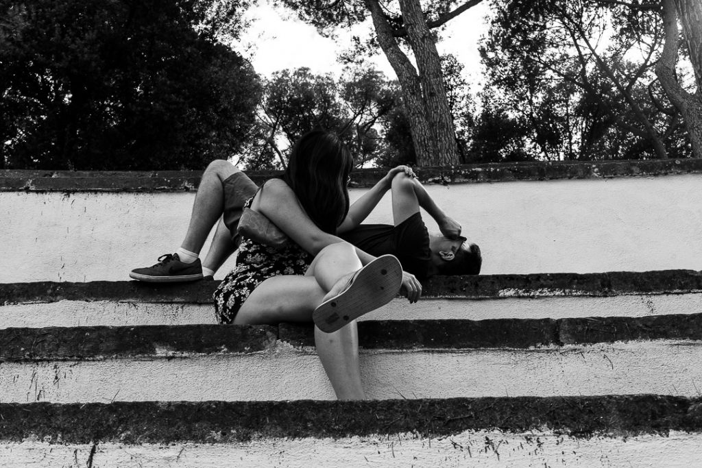 young couple rest at the Villa Borghese
